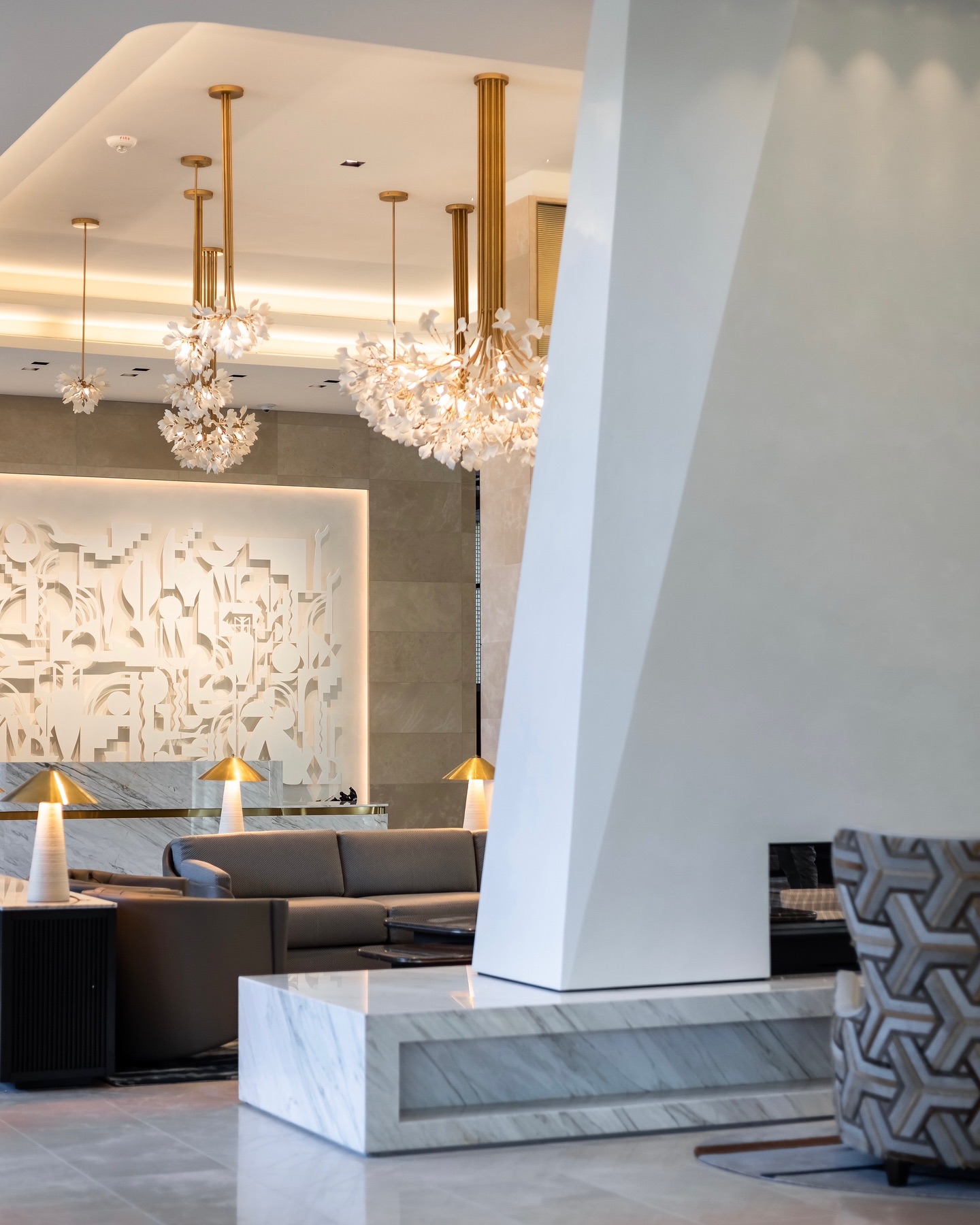 The dramatic central fireplace inside the lobby