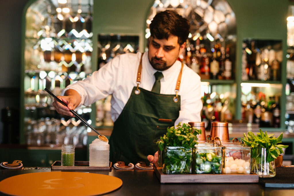 Stewart's Croquet & Cocktails - mirrored bar wall in croquet court green
