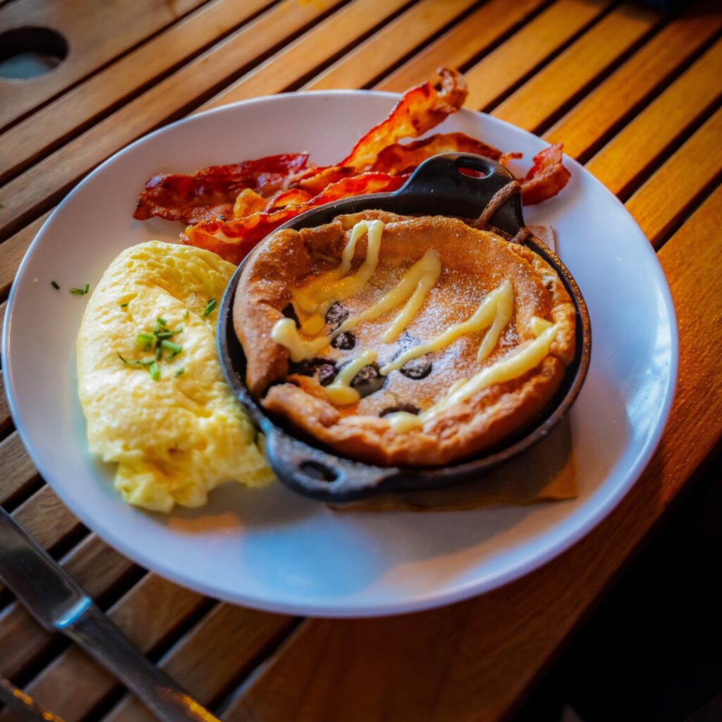 Chef Rishel's famous Dutch baby with lemon curd and fresh blueberries at Wishbone & Flynt