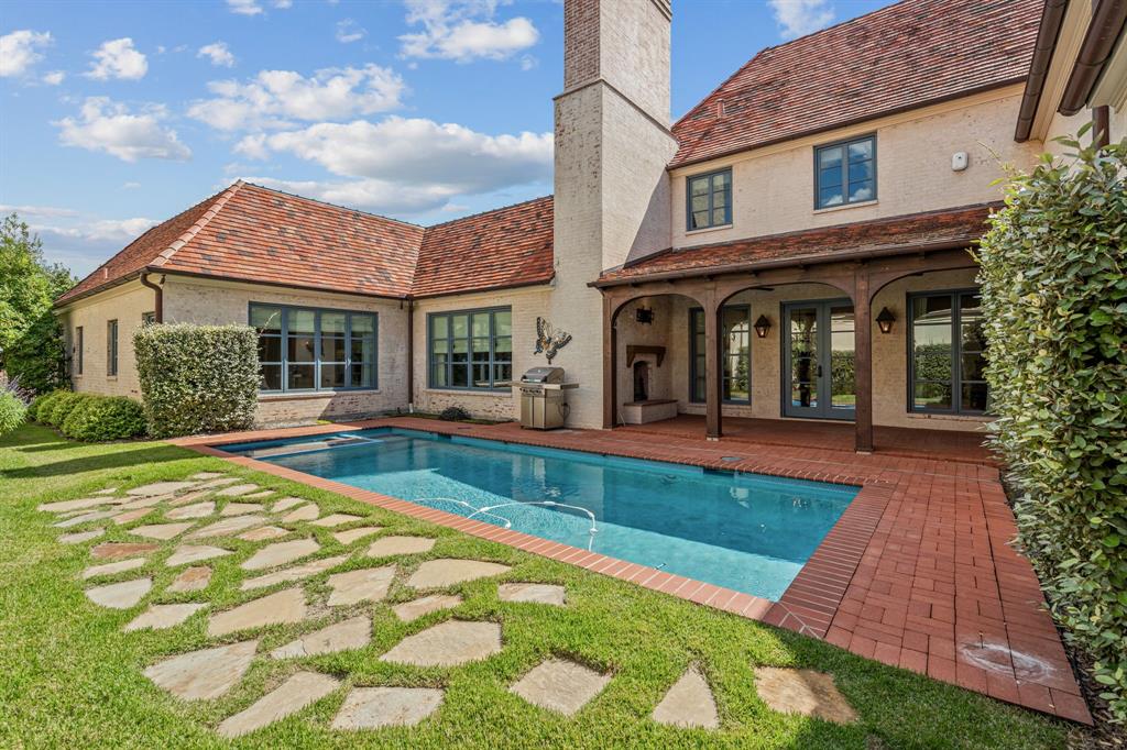 The pool and patio wrapped by a private courtyard