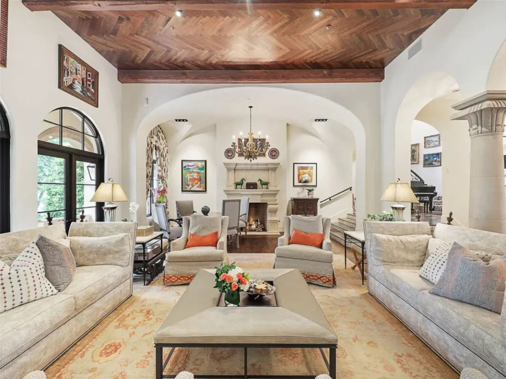 1110 Post Oak Place - Archways, columns and cast stone fireplaces blend with herringbone wood ceiling in the family room