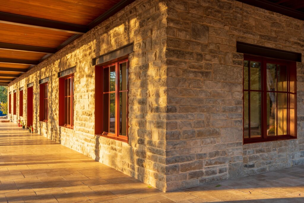Exterior clad in reclaimed Texas limestone from the Keith family ranch in Wichita Falls.