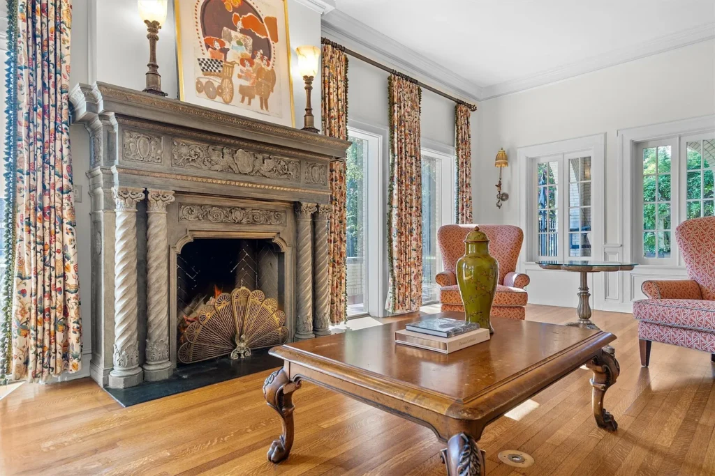 Warm woods, natural light and the living room's carved fireplace mantle