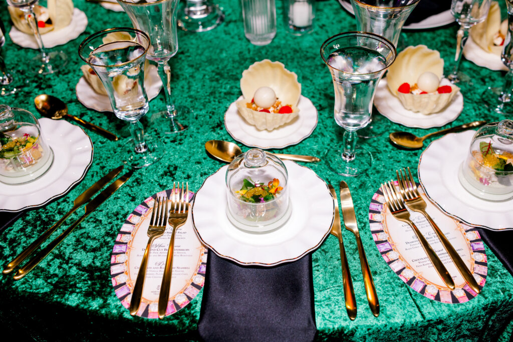 Tables set with crab & shrimp salad, basil mint panna cotta, with mango pearls, chocolate & raspberry “Seashell” whipped vanilla bean crème fraîche, and fresh raspberries
