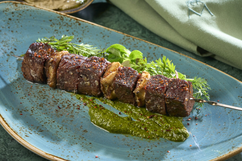 A skewered and grilled kebab at Meraki