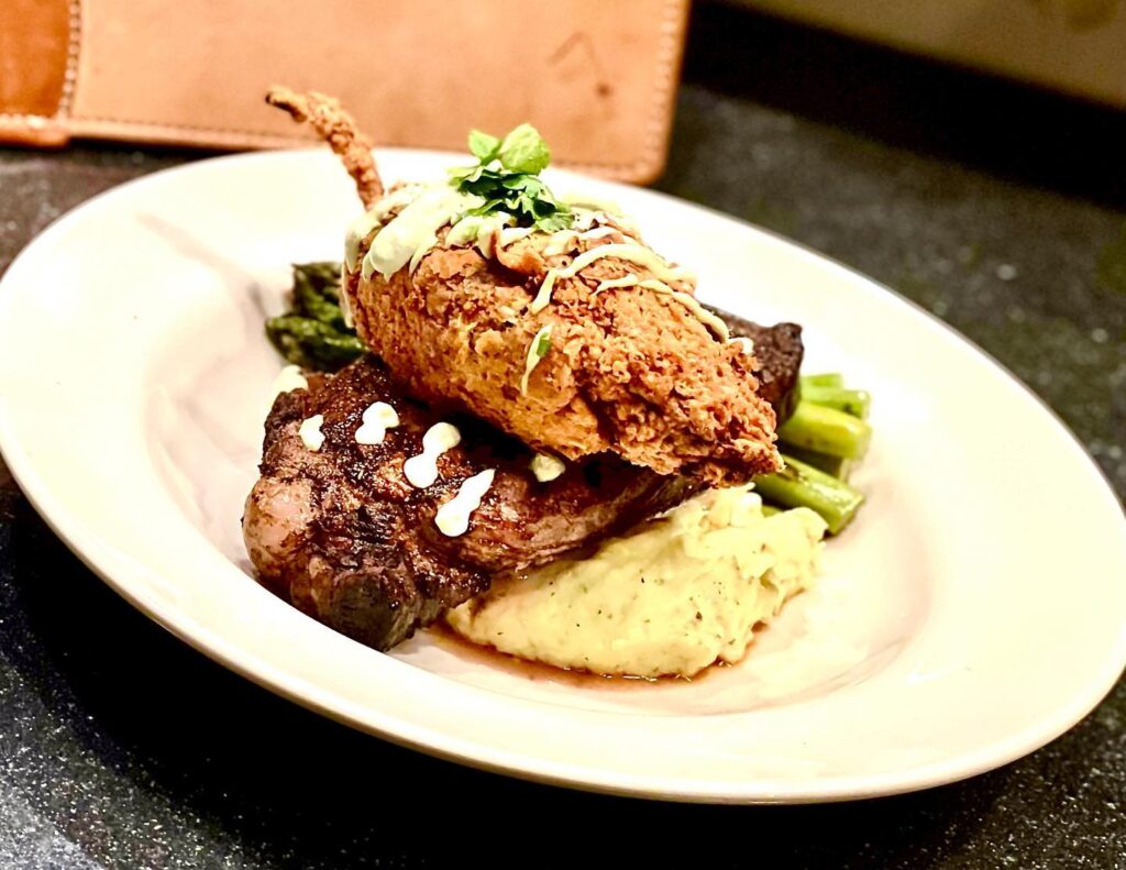 Poblano pepper tops a ribeye steak and mashed potatoes
