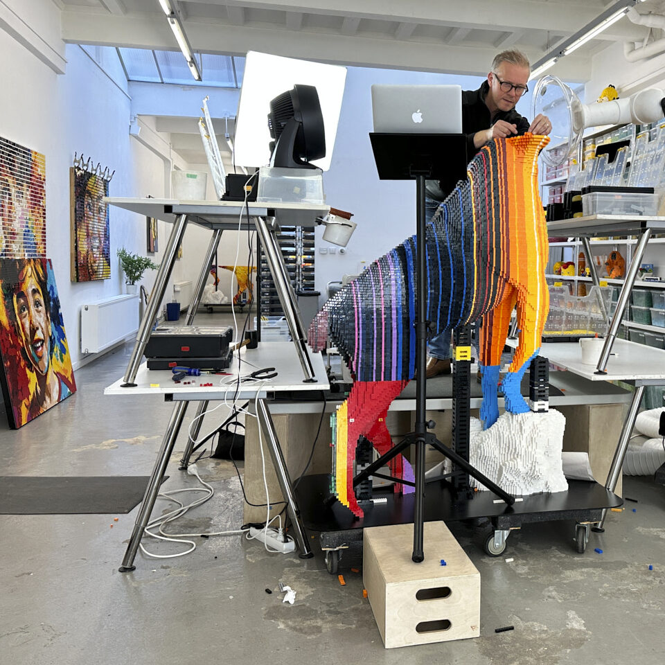 Sean Kenney in his studio with his medium of choice - LEGO bricks.