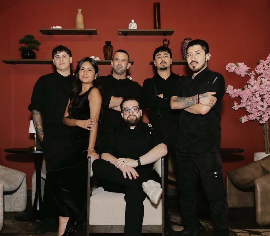 Teamwork makes the dream work at Katei. Chef Cris Marino shown seated