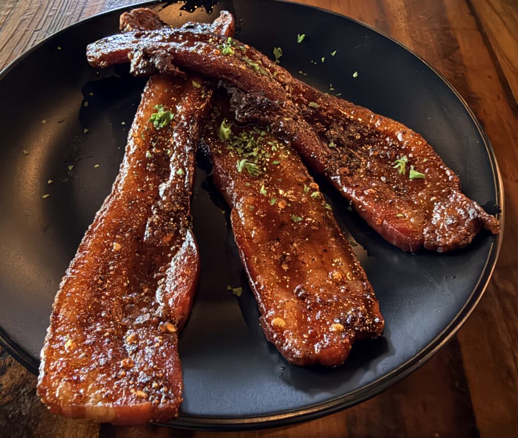 The sweet and spicy thick cut bacon is a must try at Seared. (Photo by Courtney Dabney)